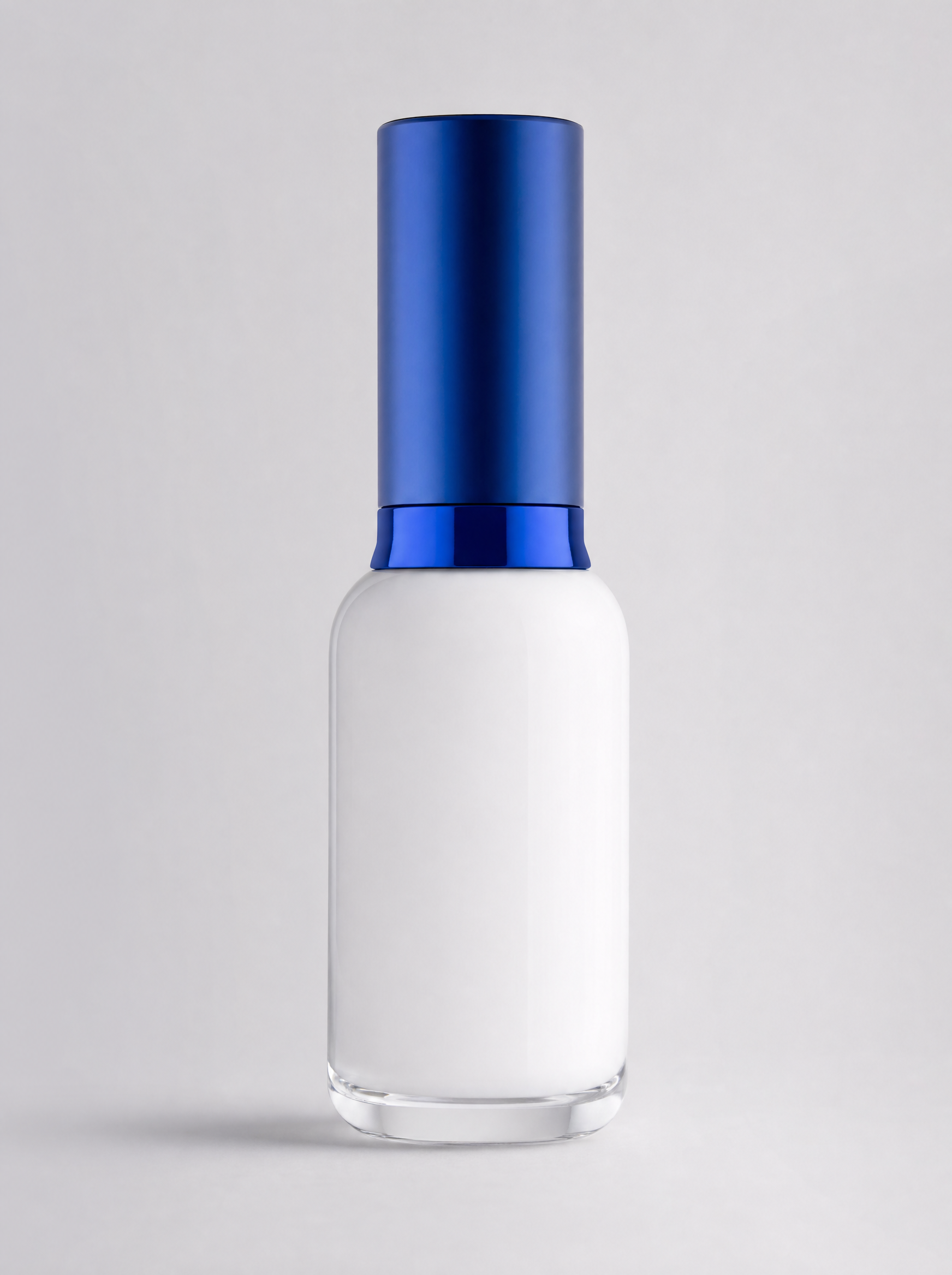 White serum bottle with a deep blue cap on light gray
